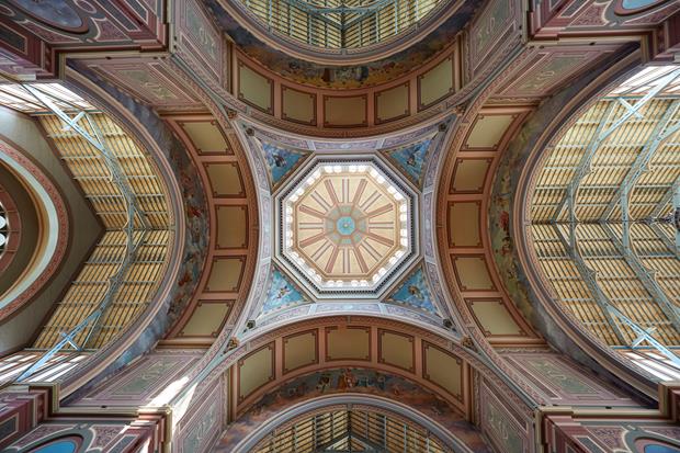 A view of a decorative ceiling from below looking up