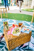 Picnic food displayed on a wicker basket